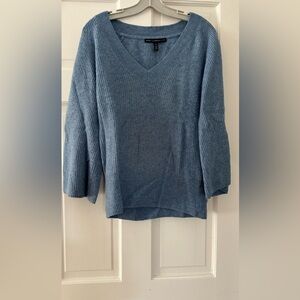 This sweater is very comfortable with wide sleeves